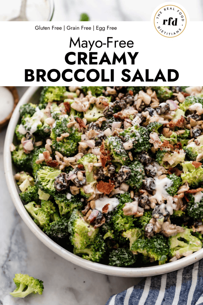 Close up view creamy broccoli salad in a white stone bowl