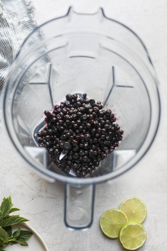 Thawed wild blueberries in blender cup