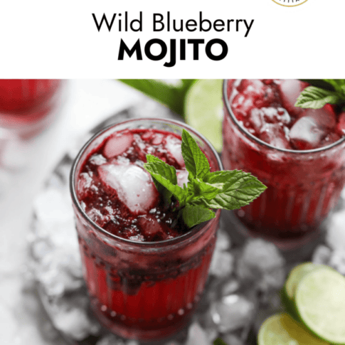 Blueberry mojito cocktail in tall glass cups served on silver tray.
