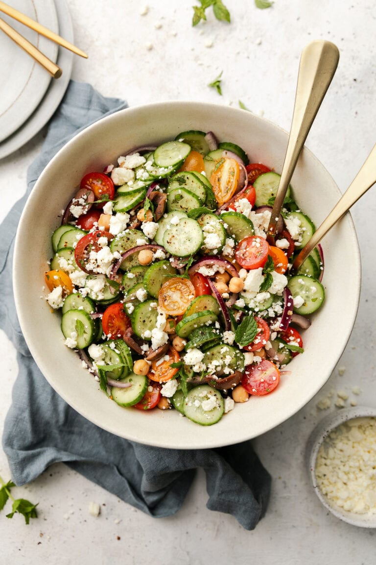 Overhead view Greek cucumber Salad topped with feta cheese