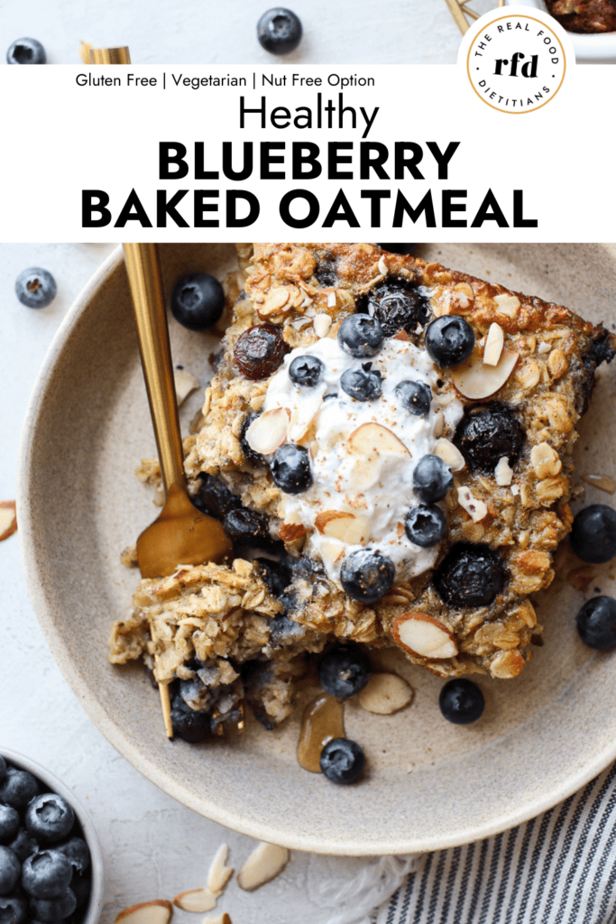 Serving of blueberry baked oatmeal topped with yogurt and fresh blueberries.
