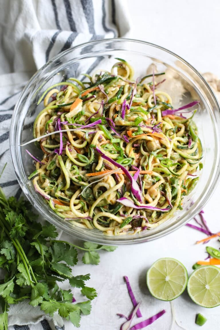 Spicy Asian zucchini noodles in a glass bowl.