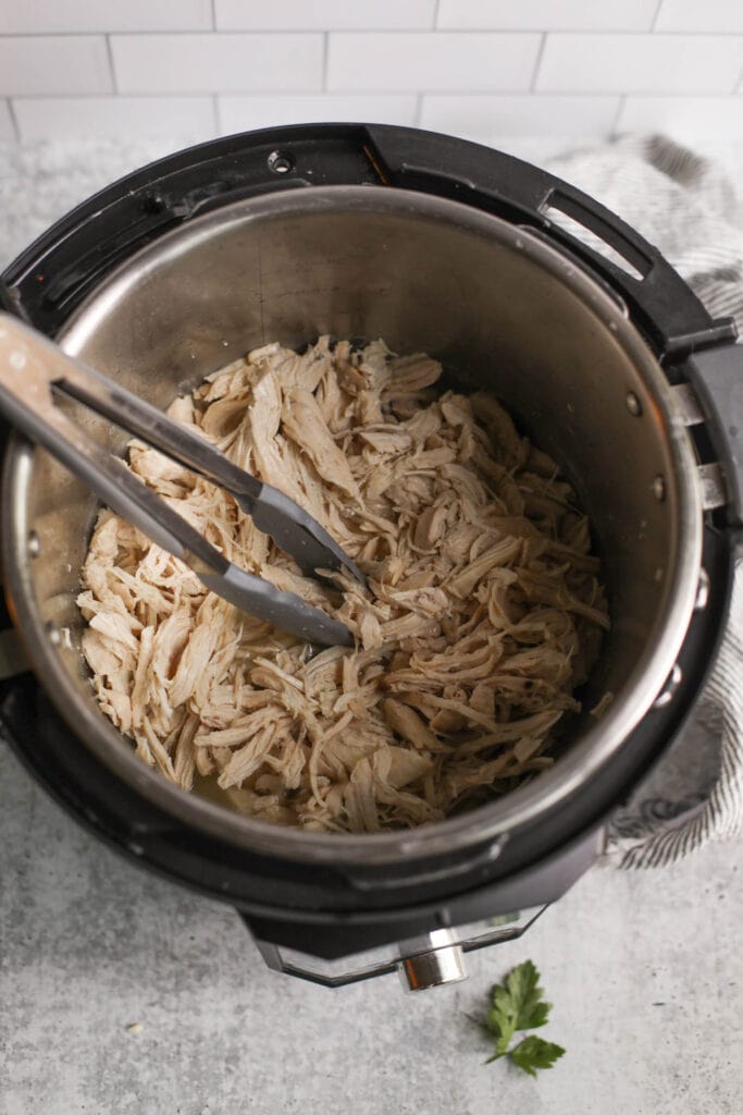 An overhead view of Instant Pot Shredded Chicken in the Instant Pot. 