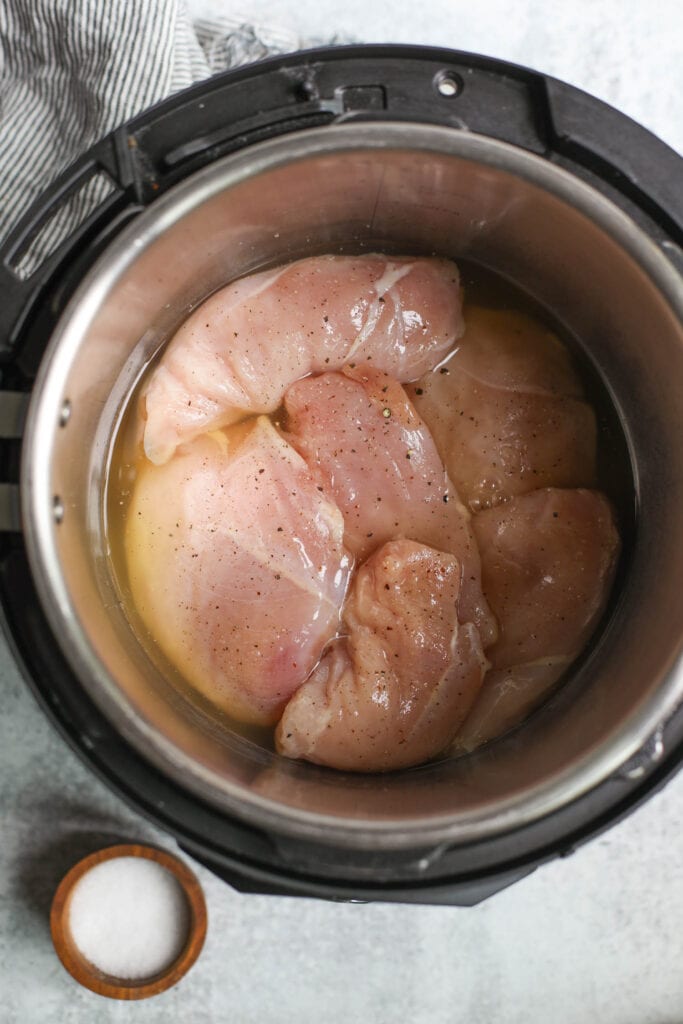 An overhead view of chicken breast in an Instant Pot. 