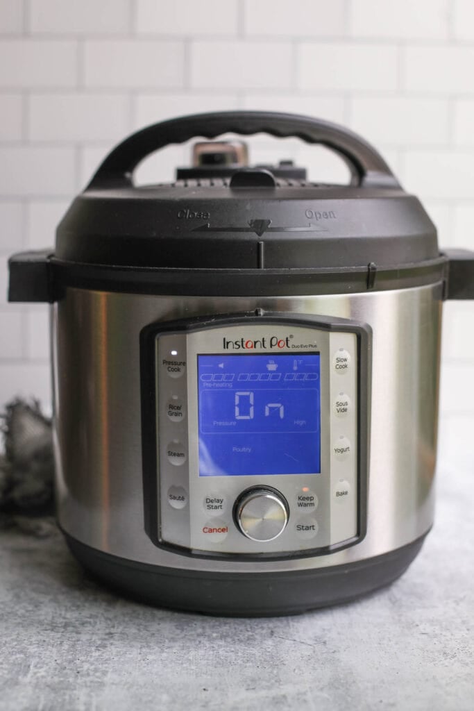 An Instant Pot sealed and coming up to pressure to make Instant Pot Shredded Chicken. 