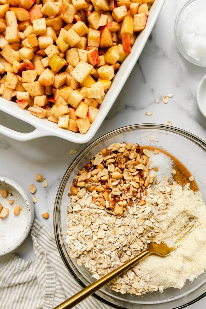 Apples, oats, and nuts about to be turned into a high fiber recipe.