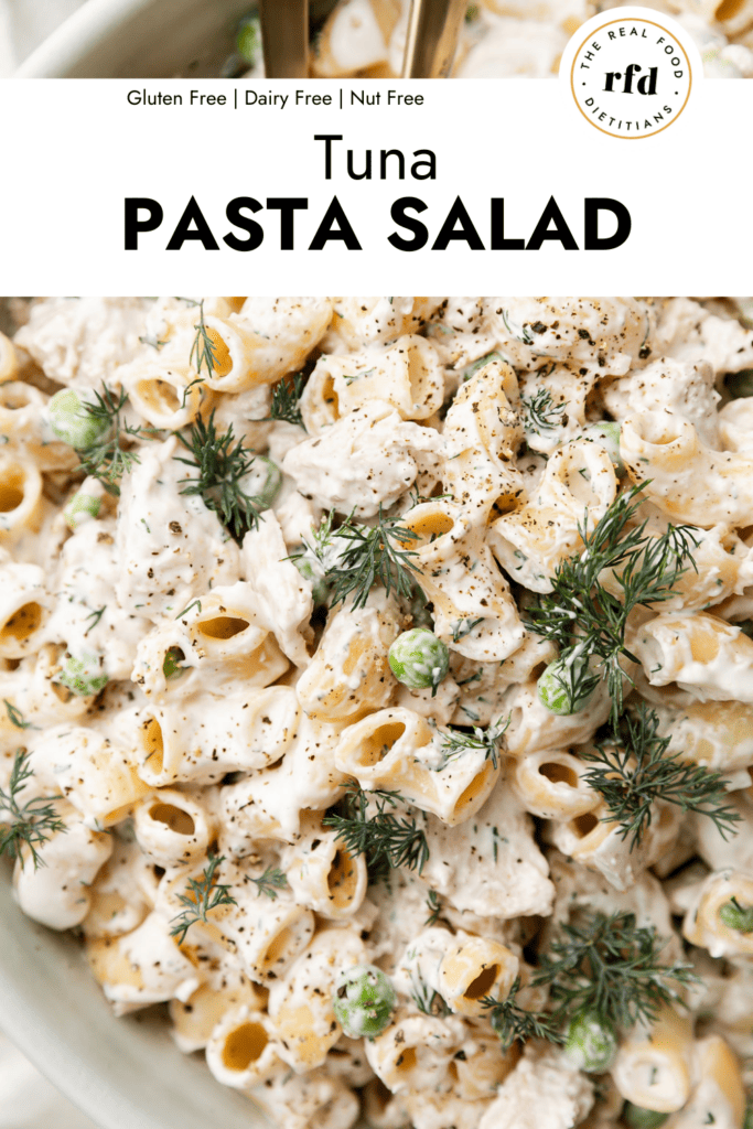 Close up view tuna pasta salad with creamy dressing coating noodles.