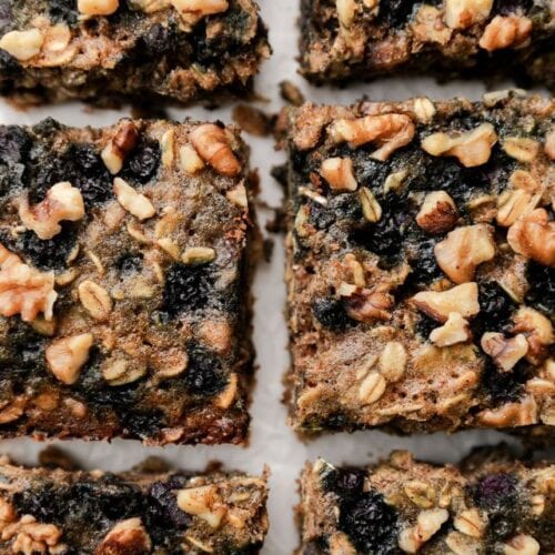 Close up overhead view oatmeal breakfast bars with blueberries cut into squares