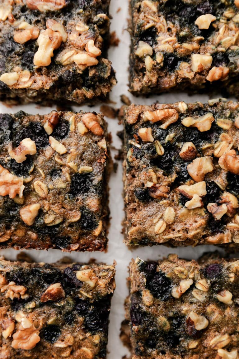 Close up overhead view oatmeal breakfast bars with wild blueberries cut into squares