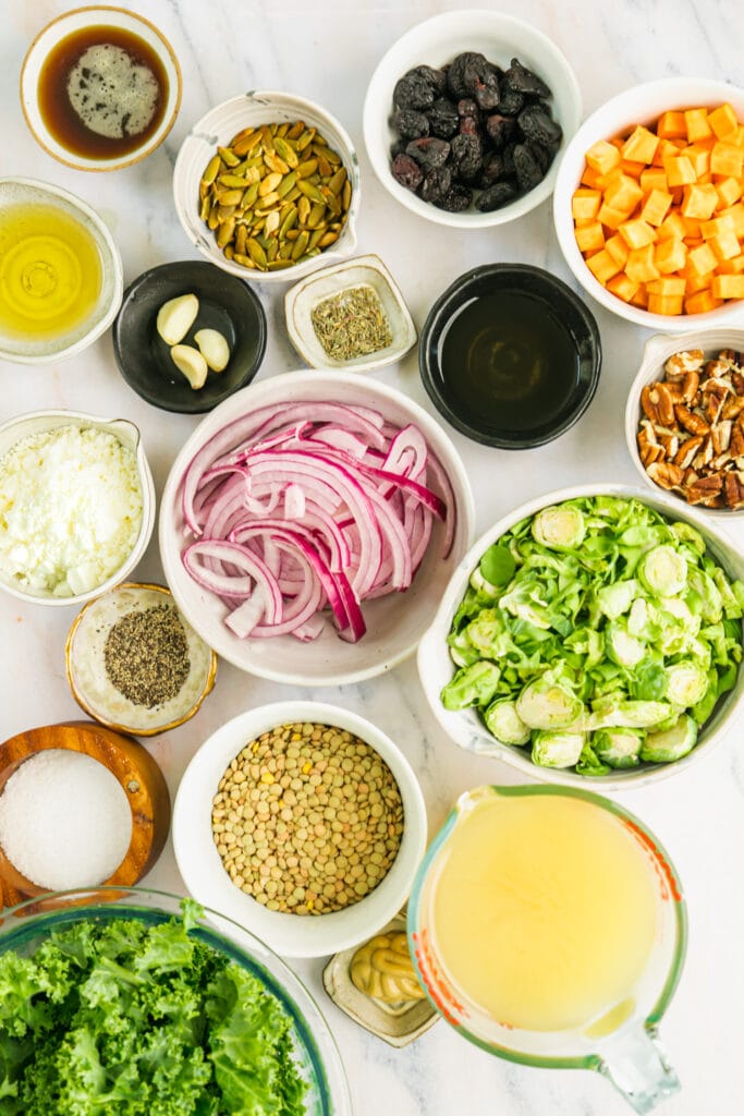 All ingredients for lentil salad arranged together in small bowls