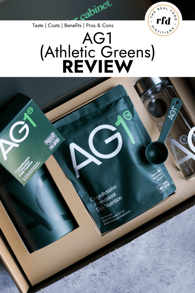 Athletic greens (AG1) pouch, shaker bottle, canister and scoop in packaging from shipping.