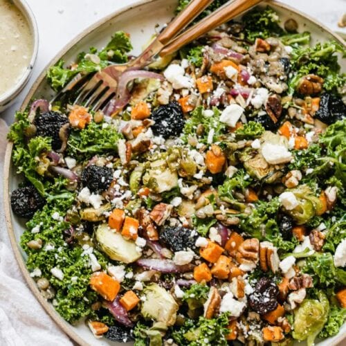 Overhead view fall lentil salad with roasted vegetables and feta cheese in serving bowl