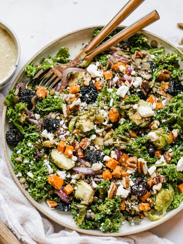 Overhead view fall lentil salad with roasted vegetables and feta cheese in serving bowl