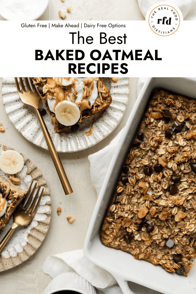 Overhead view banana chocolate chip baked oatmeal in white baking dish with servings on stone plates topped with yogurt, banana slices, and peanut butter drizzled on top.