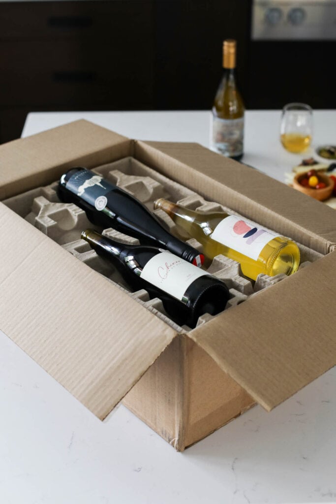 Dry wine farm labeled wine bottles in special wine packaging in box for shipment