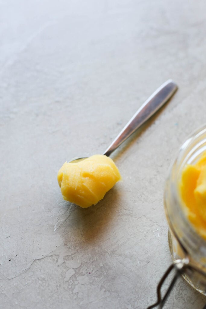 A single spoonful of ghee on a counter. 