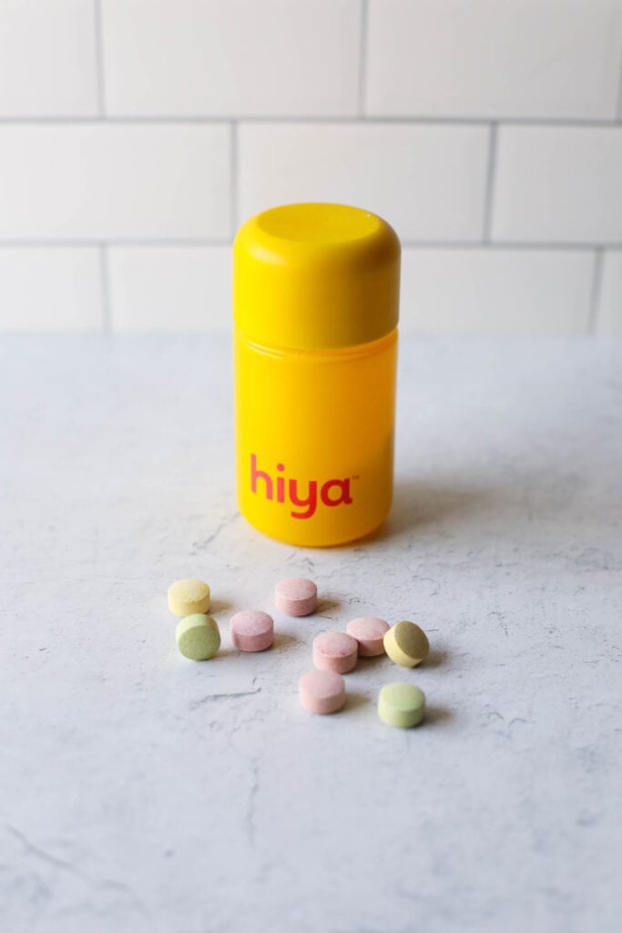 Yellow bottle of Hiya Kids multivitamins against white background