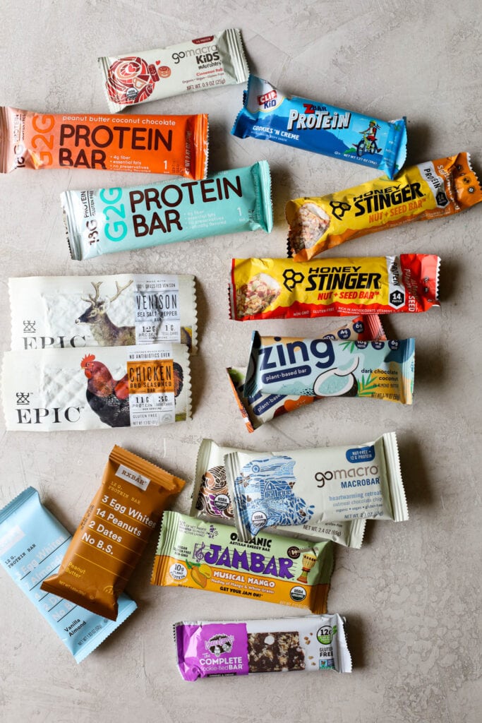 Overhead view several different protein bars arranged together on countertop