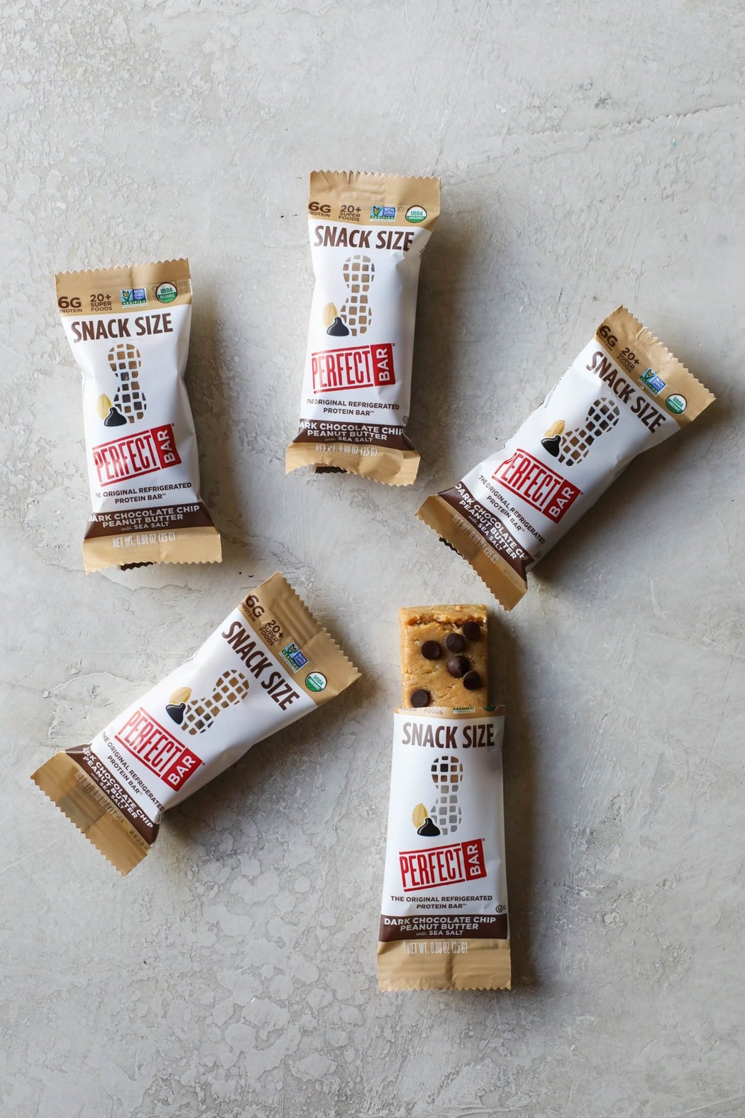 Overhead view of snack sized perfect protein bars on a counter top. 