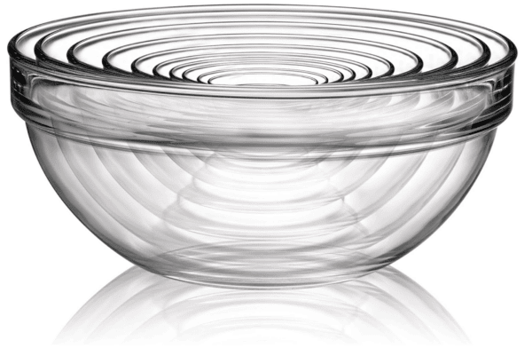 Clear glass mixing bowl nested together against white background