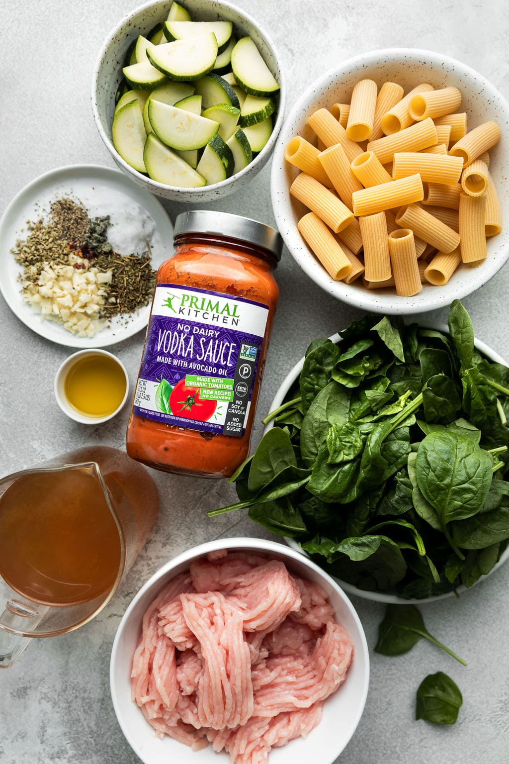 All ingredients for rigatoni arranged together in small bowls