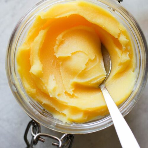Overhead view glass jar filled with ghee