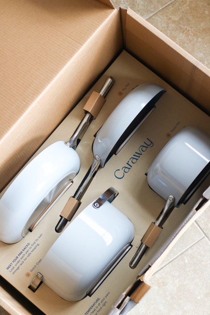 Caraway pots and pan in a box with branded logo