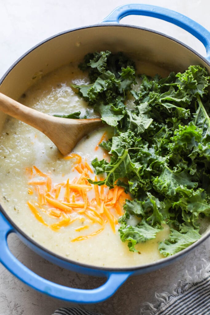 Getting ready to stir in cheese and kale for this yummy Loaded Cauliflower Soup. 