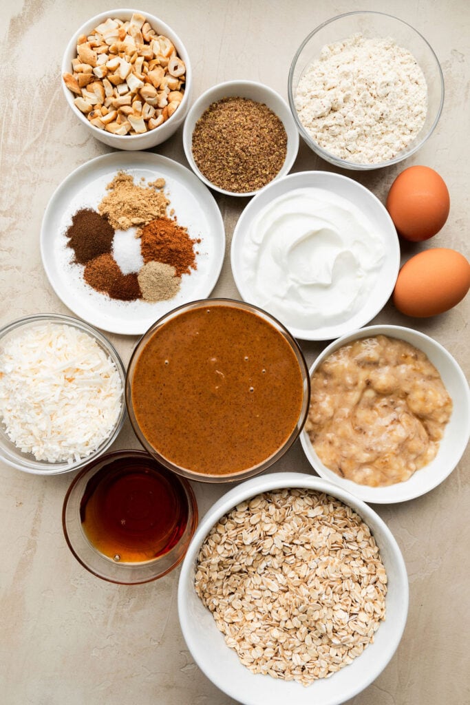 Overhead view of a variety of bowls containing ingredients for chai spice cookies. 
