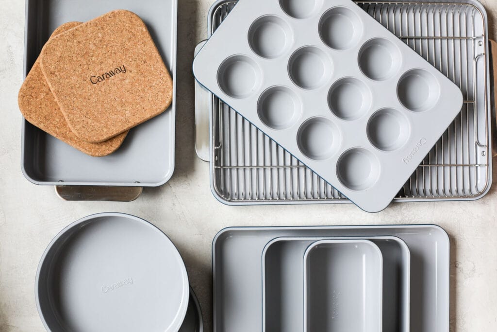 Overhead view of a variety of Caraway baking dishes and hot pads. 