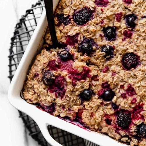 Mixed berry baked oatmeal in a white baking dish