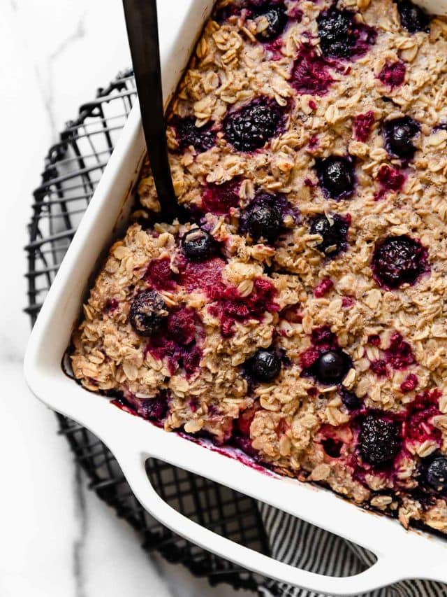 Mixed berry baked oatmeal in a white baking dish