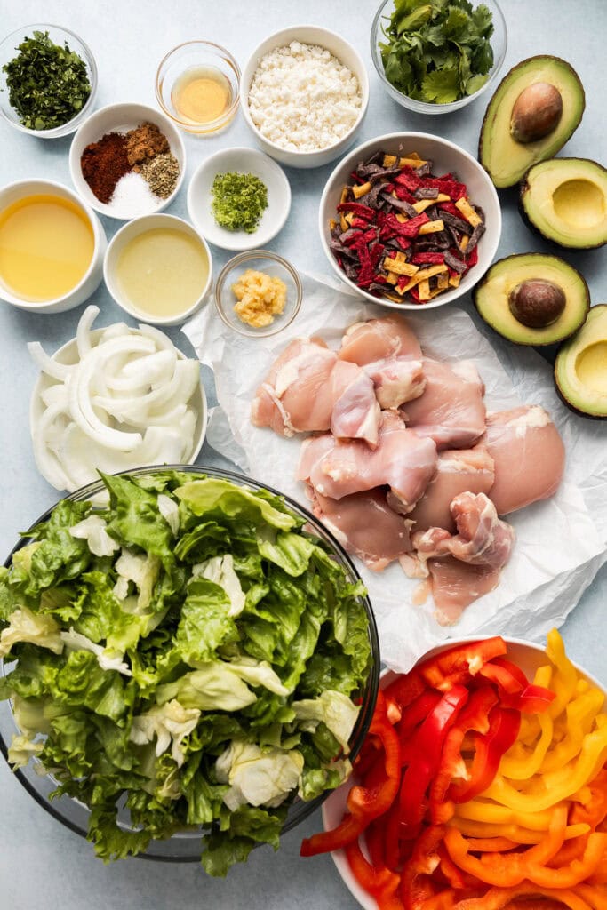 Overhead view of ingredients for grilled chicken fajita salad. 