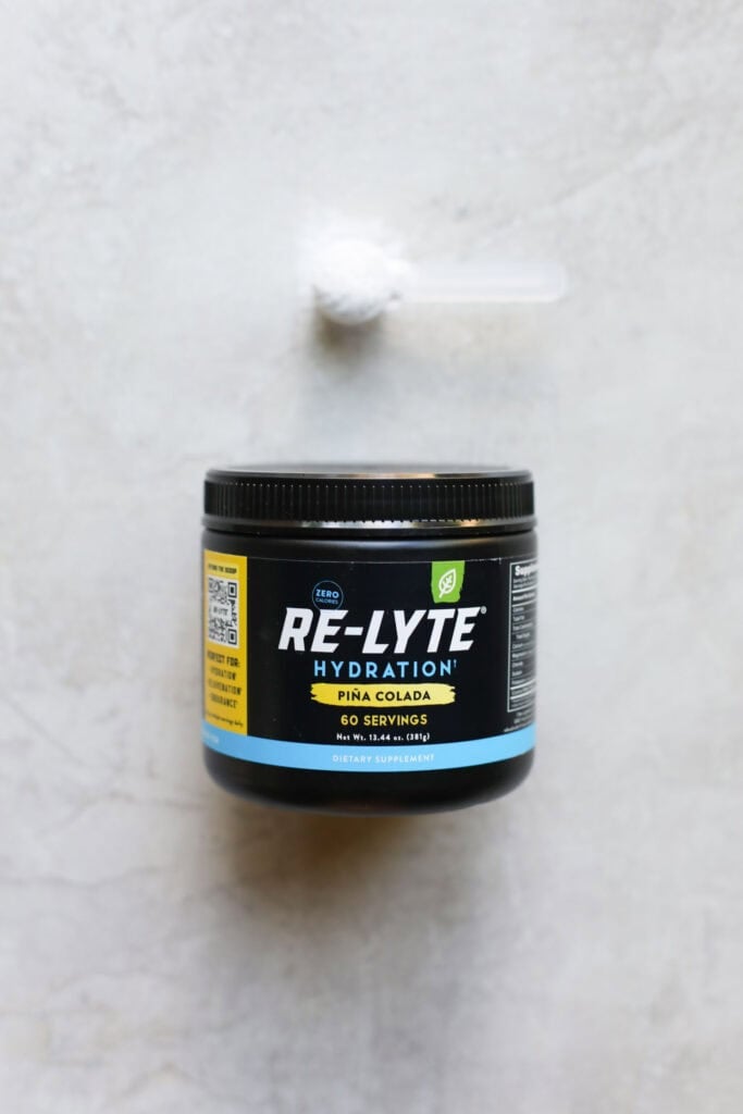 A canister of Re-Lyte brand pina colada hydration powder. 