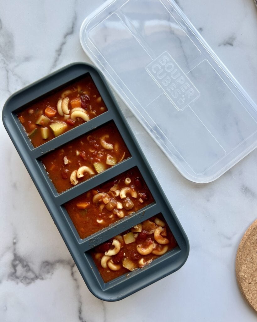 Overhead view of a souper cube container filled with soup ready for freezing and storing. 