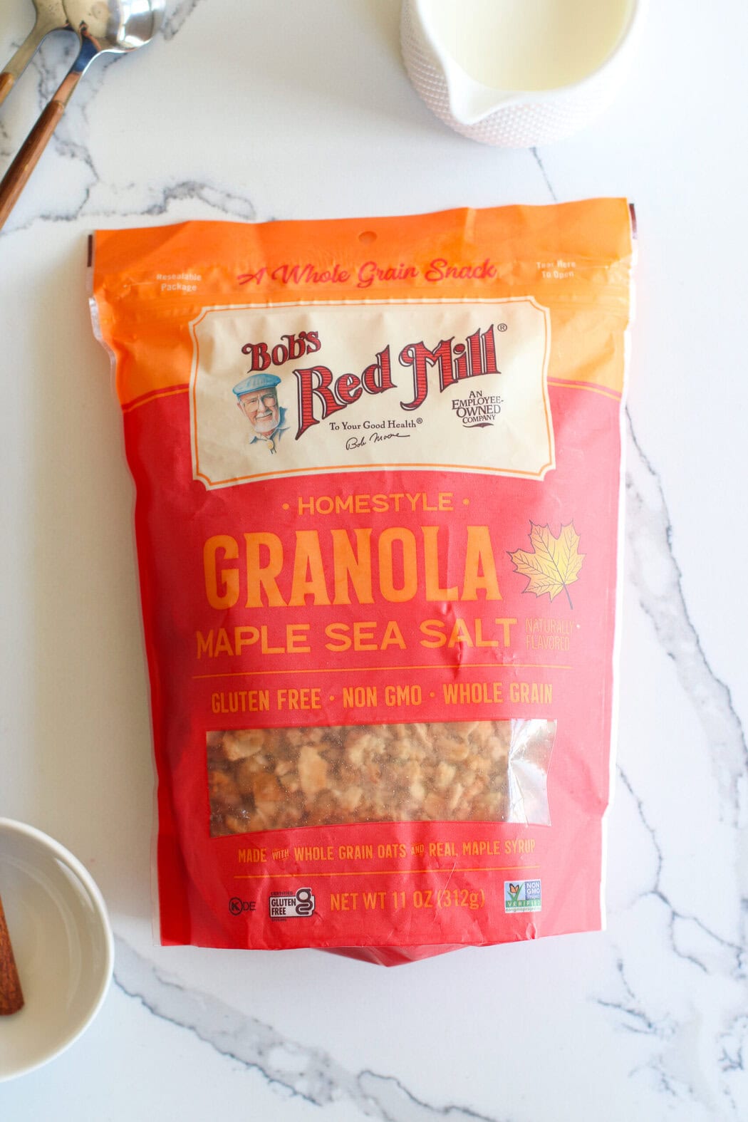 Overhead view of a bag of Bob's Red Mill homestyle granola with maple sea salt. 