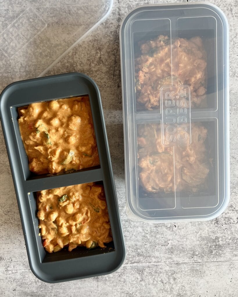 Overhead view of a souper cube container filled with food ready to be frozen and stored. 