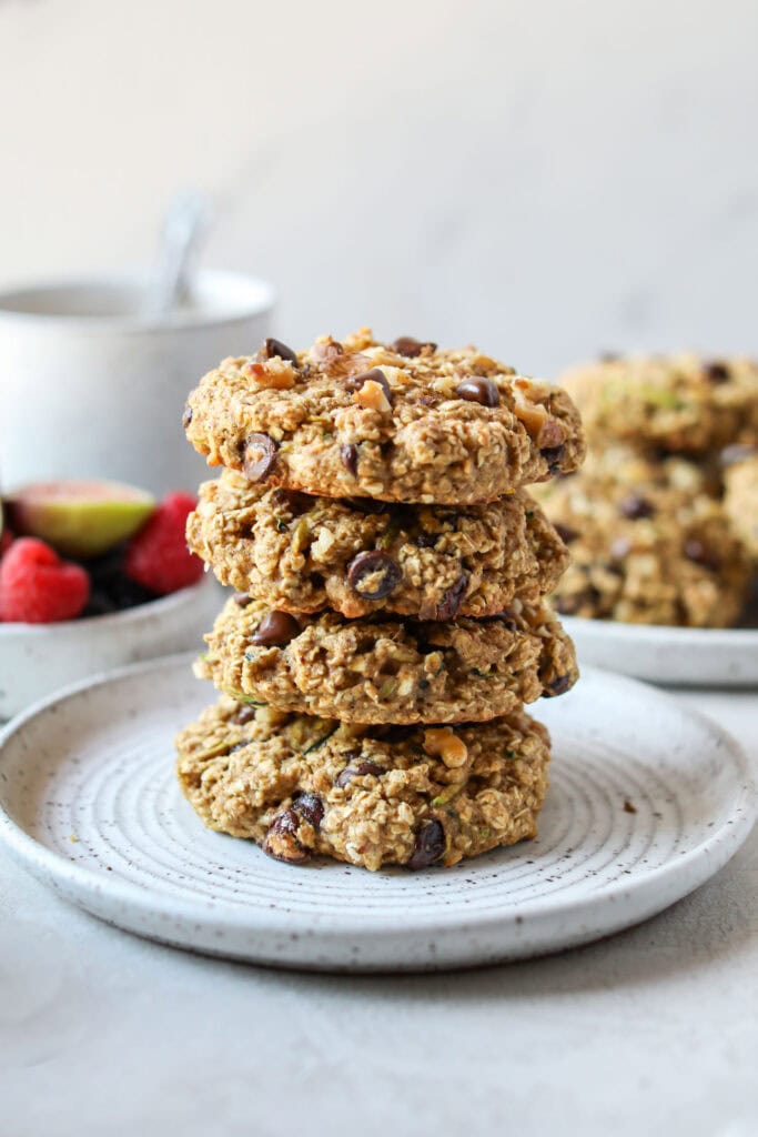 A stack of Delicious Zucchini Breakfast Cookies on a white plate. 