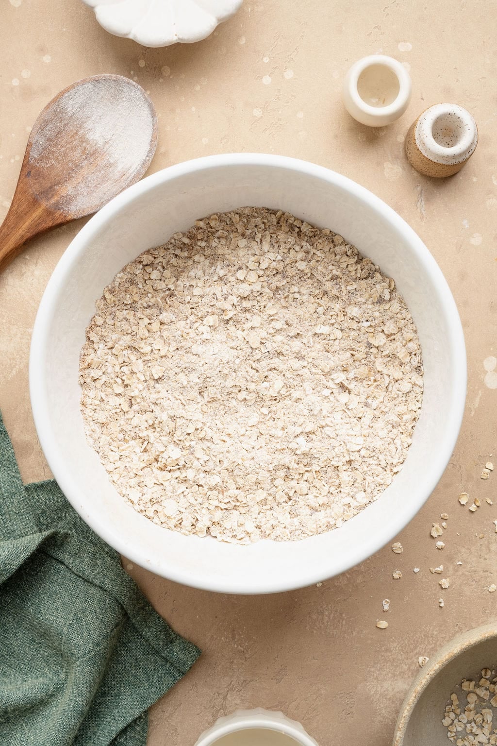 A bowl of mixed dry ingredients to make zucchini breakfast cookies.