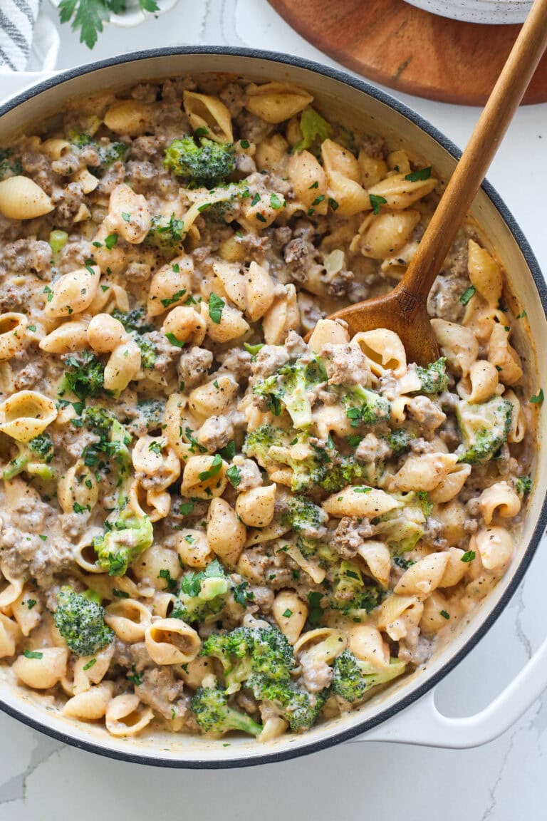 Overhead view hamburger helper with broccoli in skillet