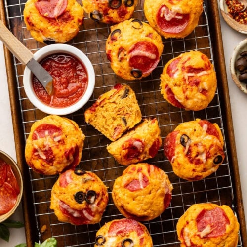 Pepperoni Pizza Muffins on a wire cooling rack on a baking sheet