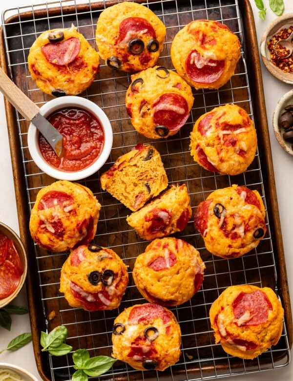 Pepperoni Pizza Muffins on a wire cooling rack on a baking sheet