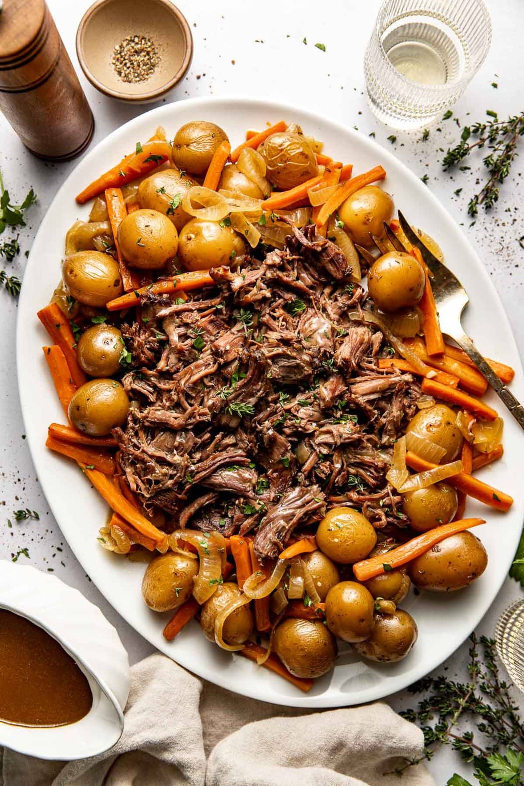 Overhead view of a plate filled with Slow Cooker Pot Roast ready for serving. 