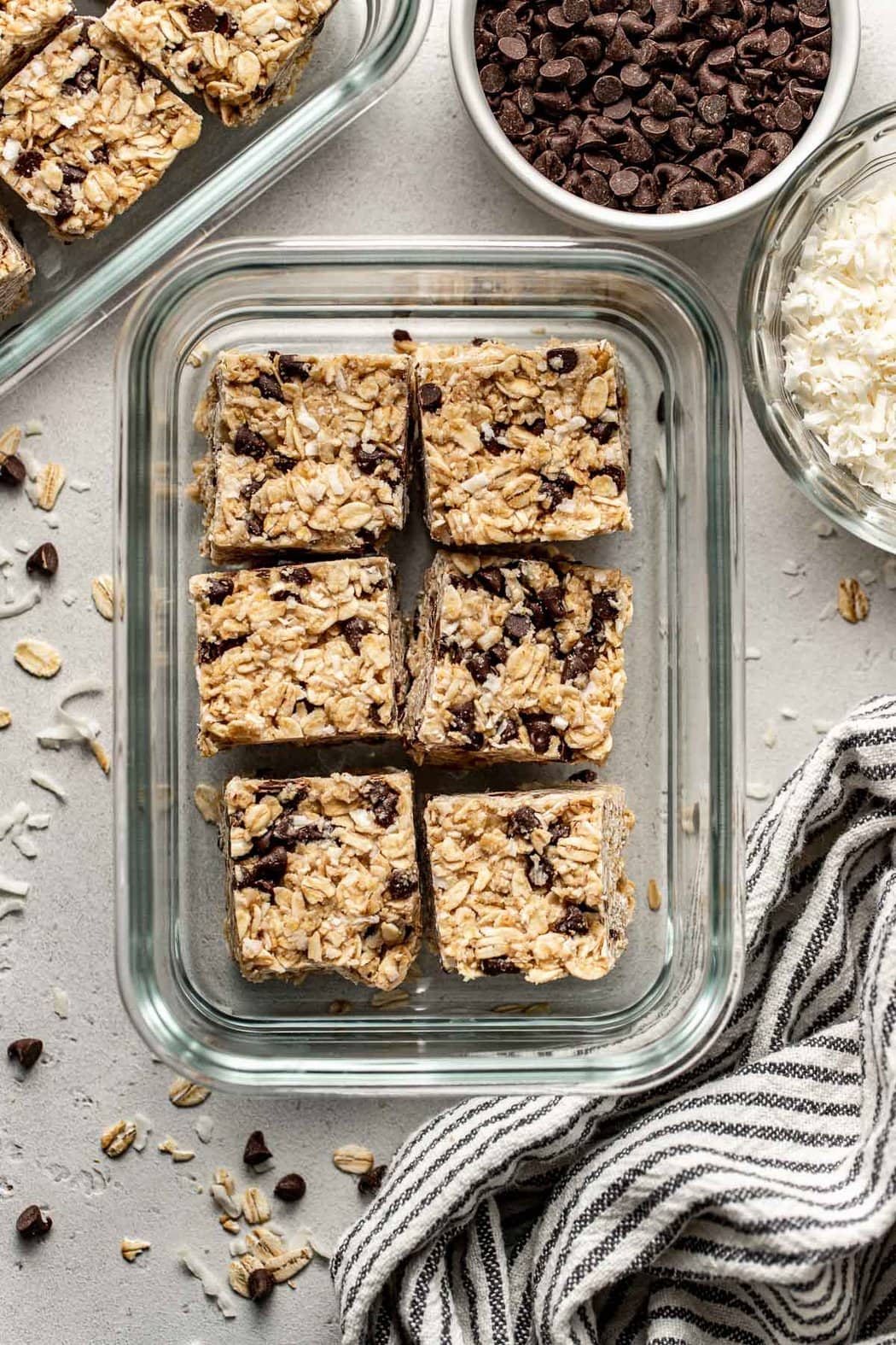 A glass meal prep container filled with six Copycat Heavenly Hunks bars. 