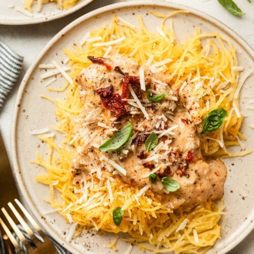 Crockpot Marry Me Chicken served over spaghetti squash strands on a plate