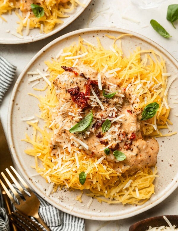 Crockpot Marry Me Chicken served over spaghetti squash strands on a plate