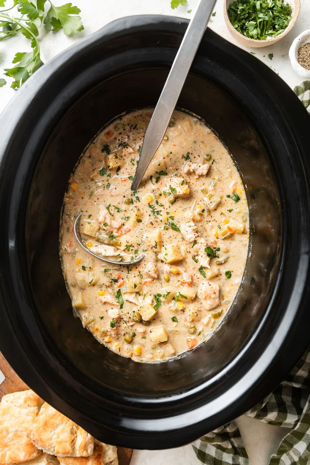 Overhead view of a slow cooker filled with Slow Cooker Chicken Pot Pie Soup. 