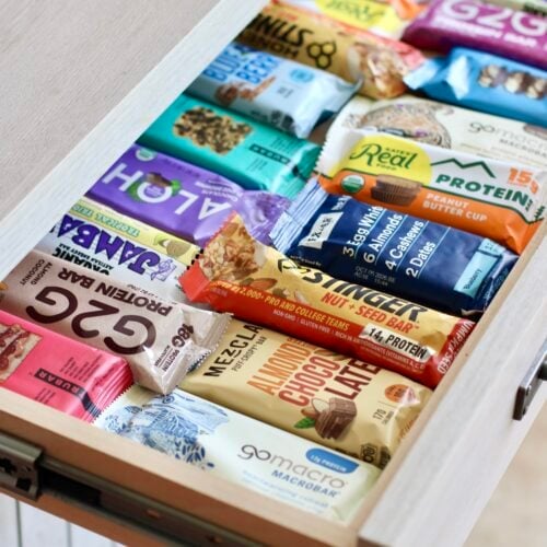 Close up view of a drawer full of packages protein bars.