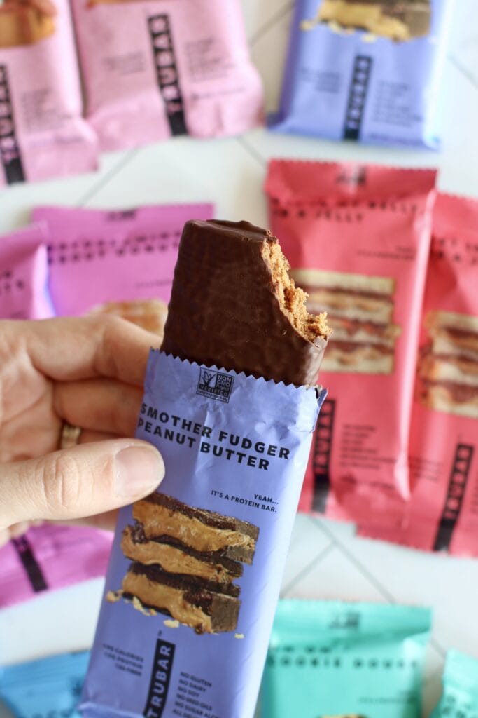 Close up view of a trubar opened and a bite out of the top to show the inside of the bar.