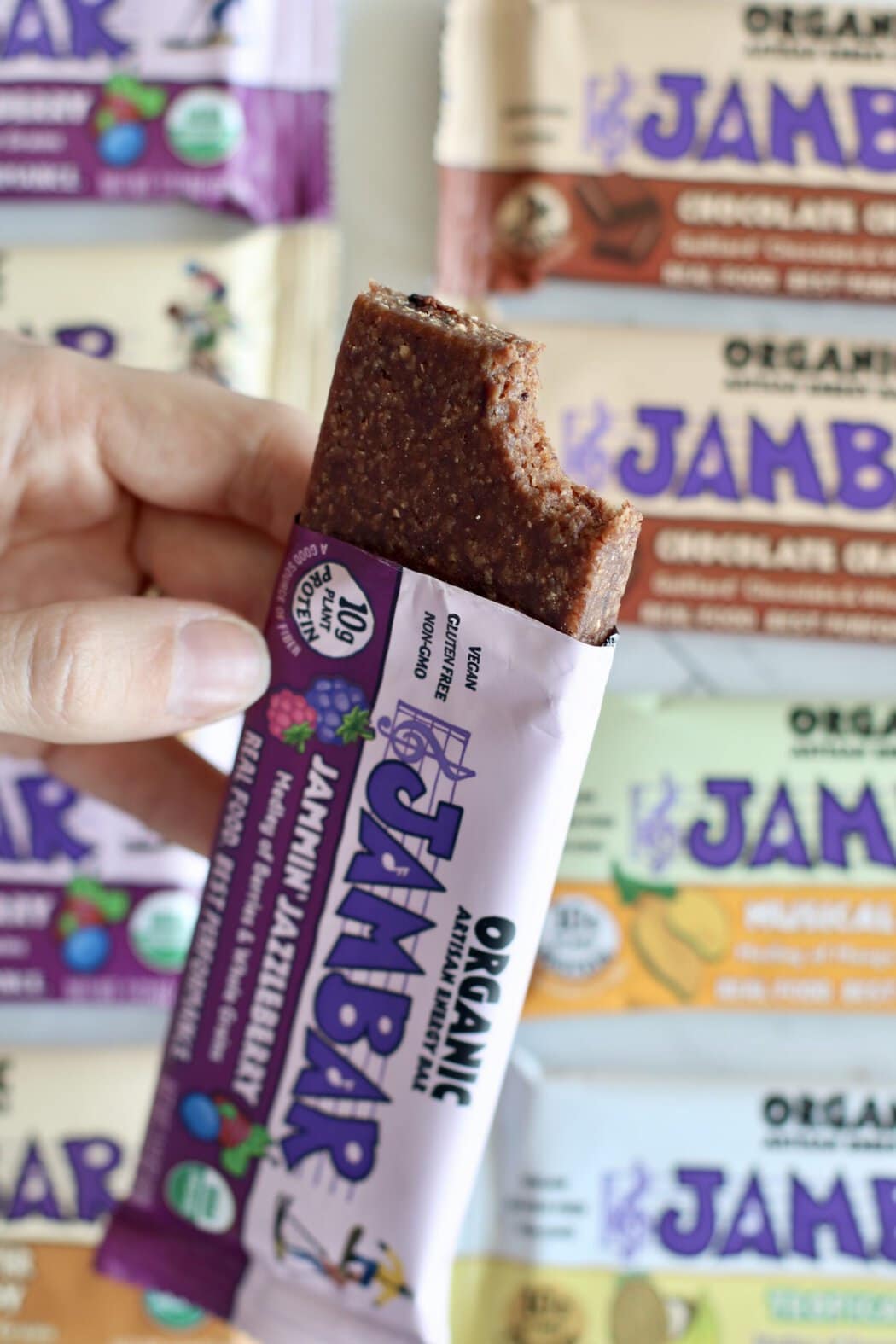 Close up view of an opened jam bar with a bite out of the top to show the texture of the bar.